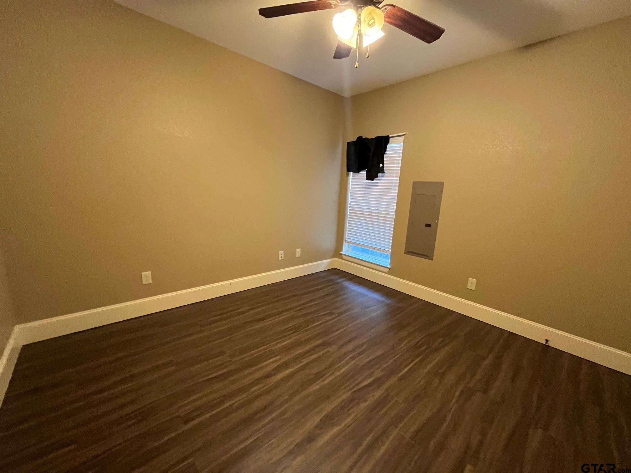 200 Water Street, Unit B Bullard, TX 75757 - Photo 14 of 14 a view of an empty room with wooden floor and a window