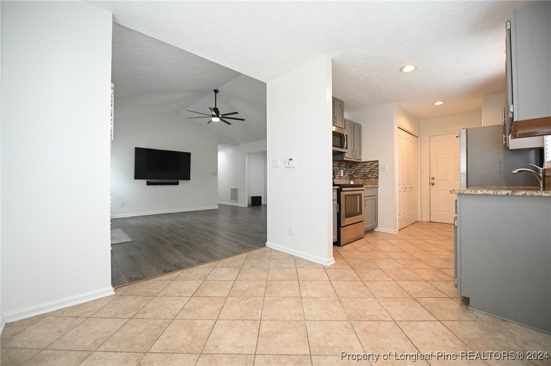 5057 Summer Ridge Road Fayetteville, NC 28303 - Photo 11 of 29 a view of a kitchen with a sink and an oven