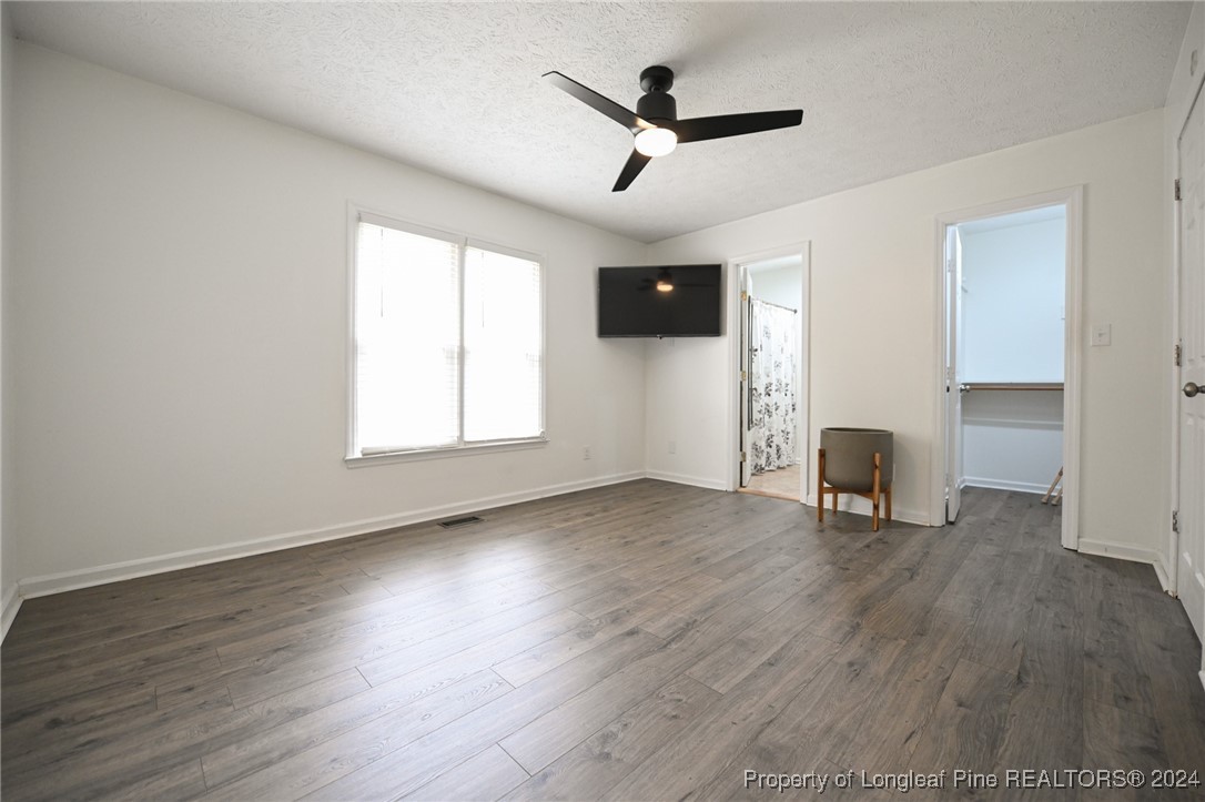 5057 Summer Ridge Road Fayetteville, NC 28303 - Photo 17 of 29 a view of empty room with wooden floor and window