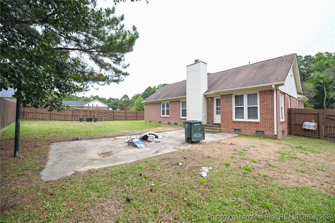 5057 Summer Ridge Road Fayetteville, NC 28303 - Photo 28 of 29 a view of a house with backyard and a tree