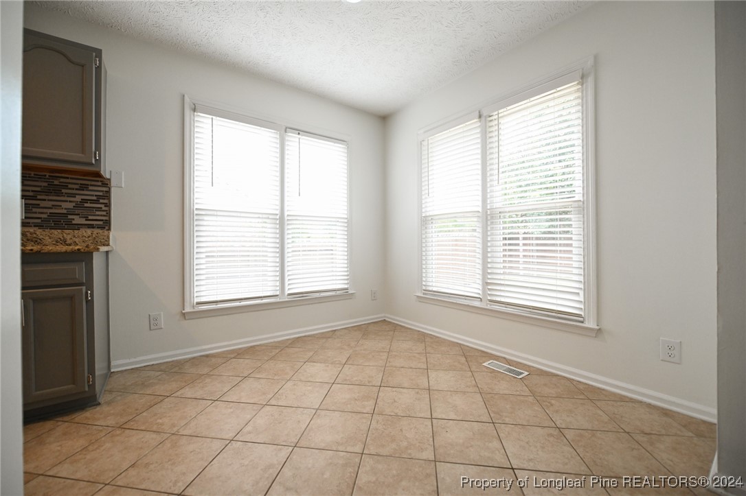 5057 Summer Ridge Road Fayetteville, NC 28303 - Photo 9 of 29 a view of an empty room with a window