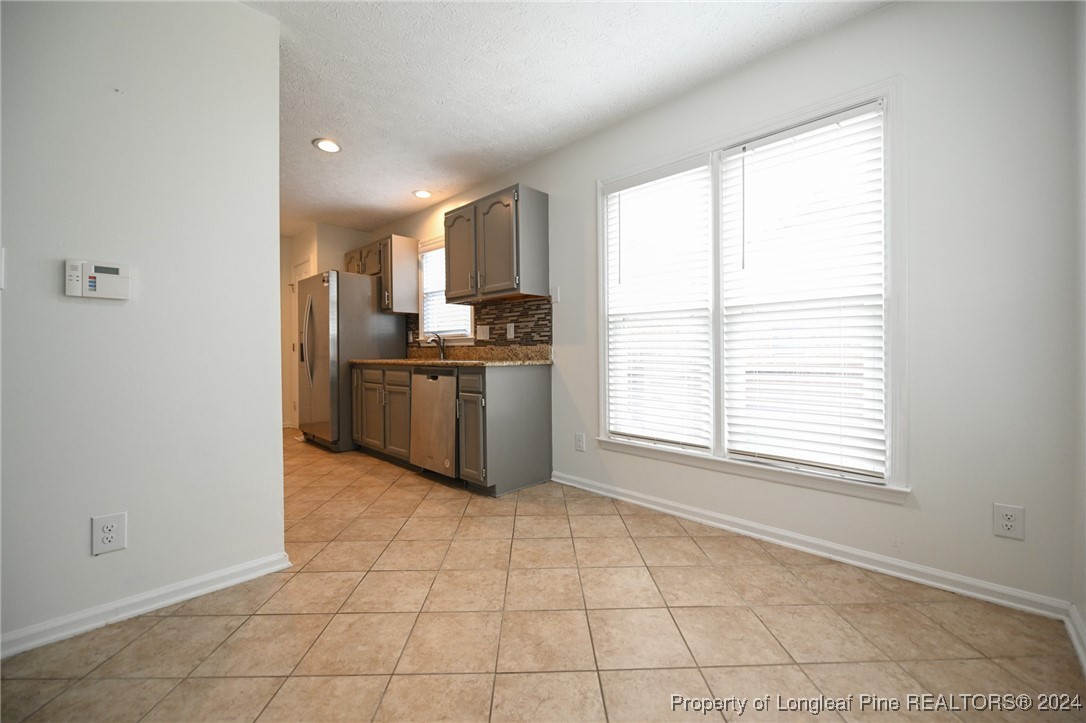 5057 Summer Ridge Road Fayetteville, NC 28303 - Photo 10 of 29 a view of a kitchen with a sink and a window