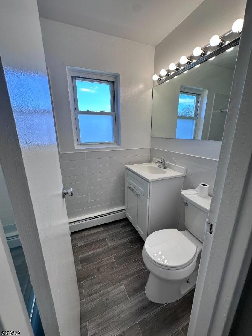 2467 Highway 10, Unit 6B Morris Plains, NJ 07950 - Photo 12 of 18 a bathroom with a toilet sink and mirror