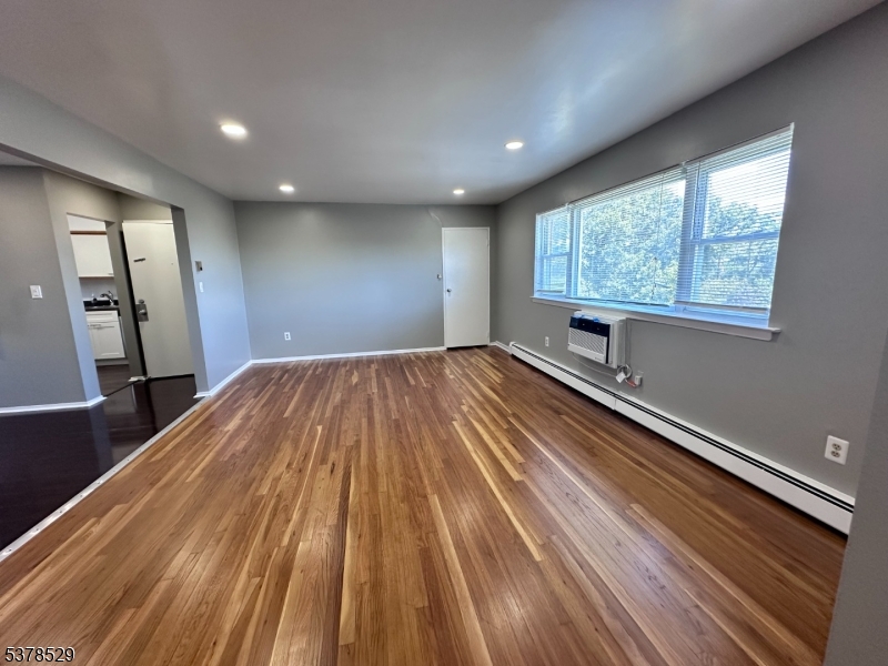 2467 Highway 10, Unit 6B Morris Plains, NJ 07950 - Photo 5 of 18 a view of a room with wooden floor and window