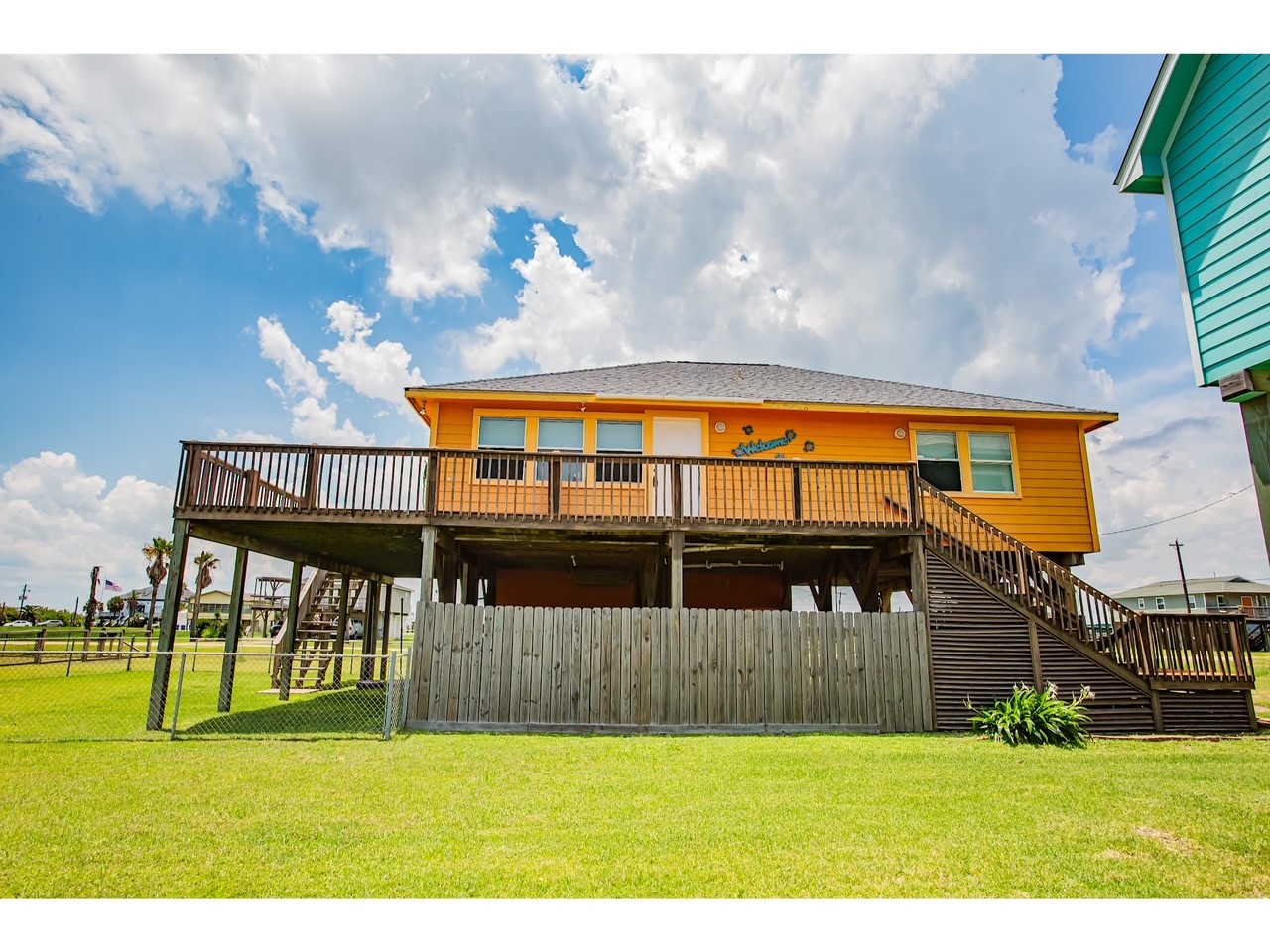 419 Thunder Road Surfside Beach, TX 77541 - Photo 5 of 32 Convenient front and back stair access enhances this home's charm.