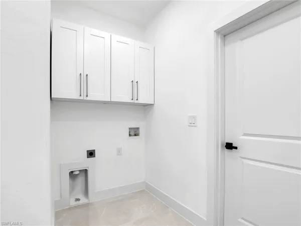 a view of cabinets and window