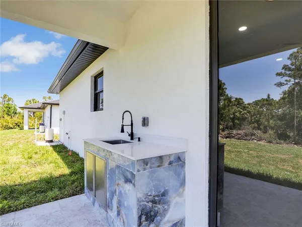 a bathroom with sink and mirror