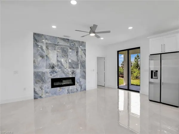 a view of an empty room with a fireplace