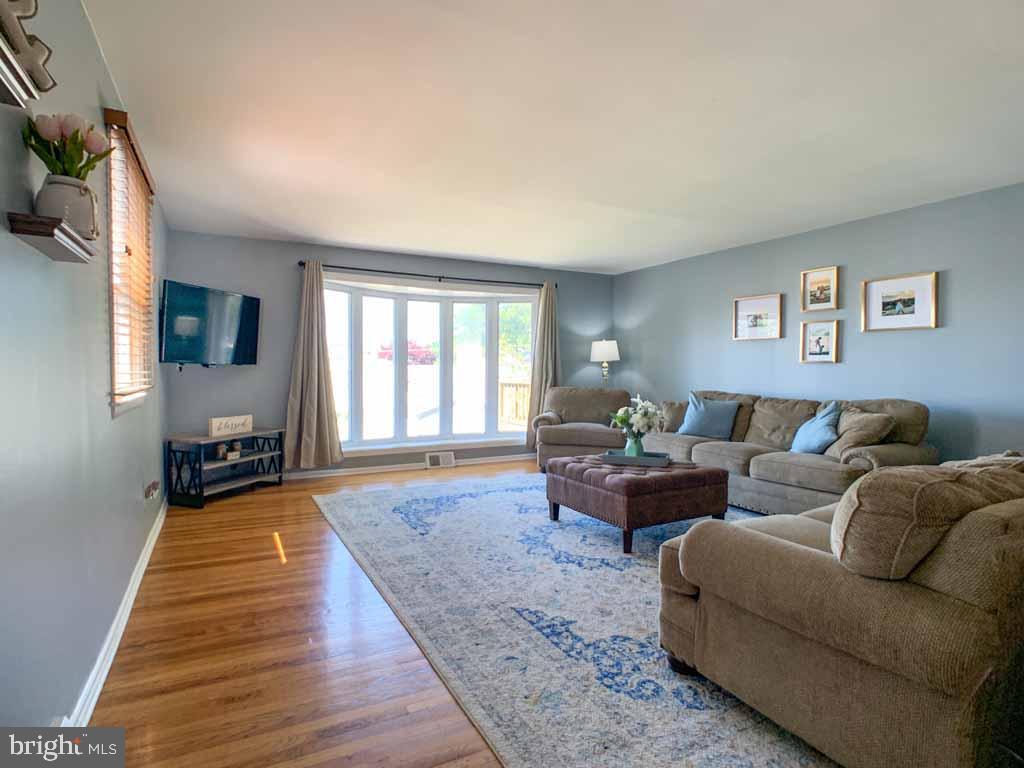 1148 Morefield Road Philadelphia, PA 19115 - Photo 3 of 35 a living room with furniture and a window