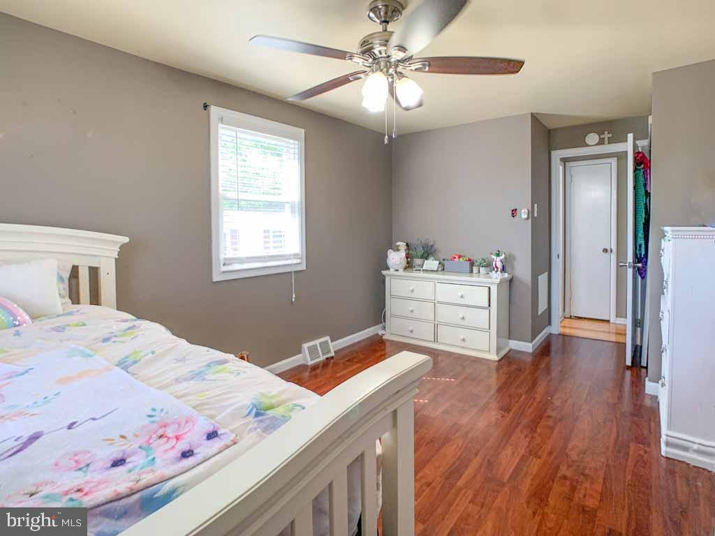 1148 Morefield Road Philadelphia, PA 19115 - Photo 21 of 35 a bedroom with a bed and a dresser