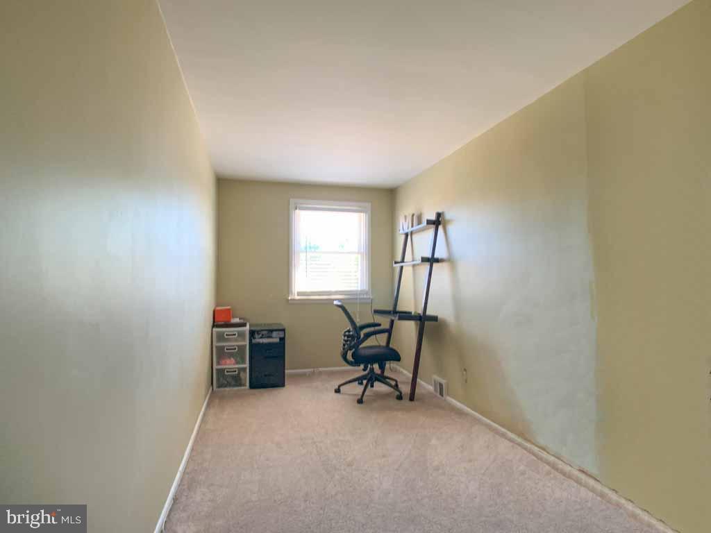 1148 Morefield Road Philadelphia, PA 19115 - Photo 23 of 35 a view of a workspace with furniture and a window