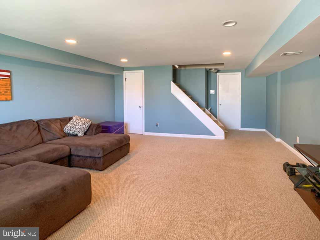 1148 Morefield Road Philadelphia, PA 19115 - Photo 27 of 35 a living room with furniture and a ceiling fan