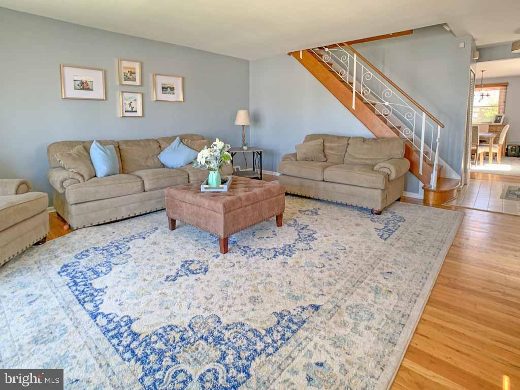 1148 Morefield Road Philadelphia, PA 19115 - Photo 4 of 35 a living room with furniture and wooden floor