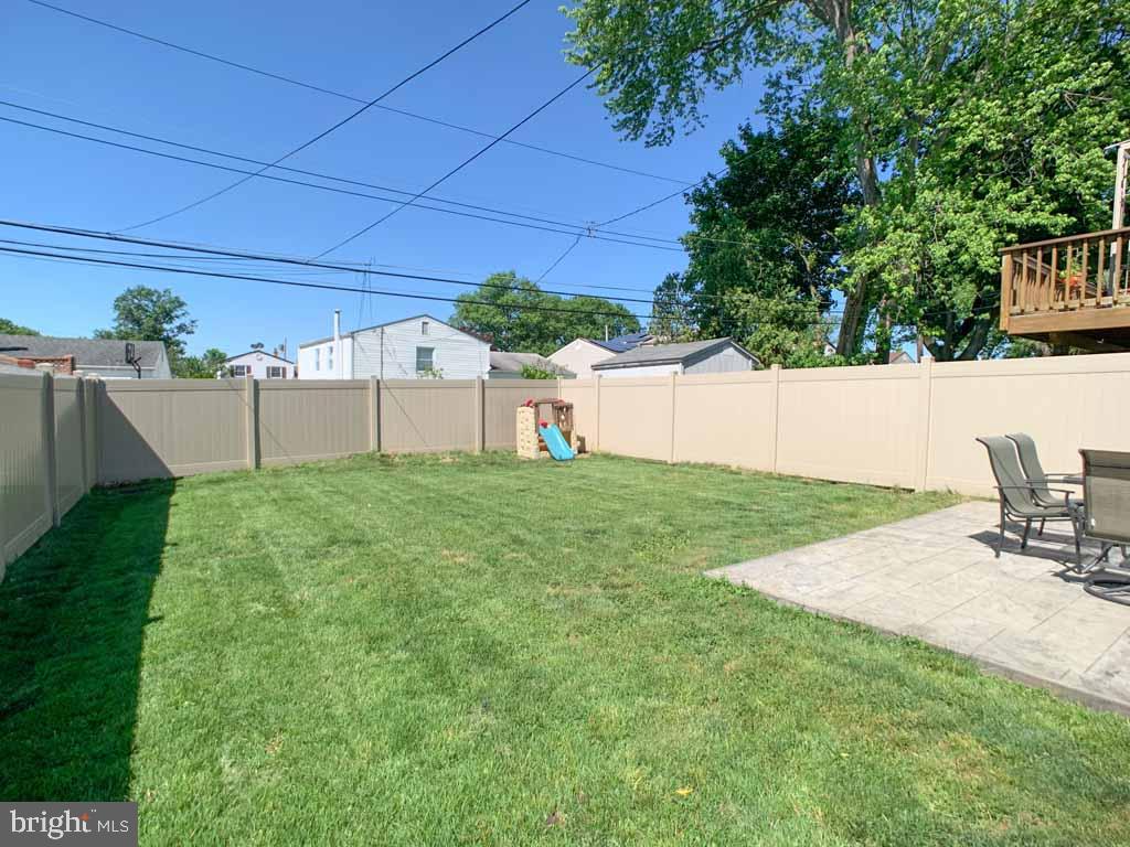 1148 Morefield Road Philadelphia, PA 19115 - Photo 33 of 35 a view of backyard with seating area and green space
