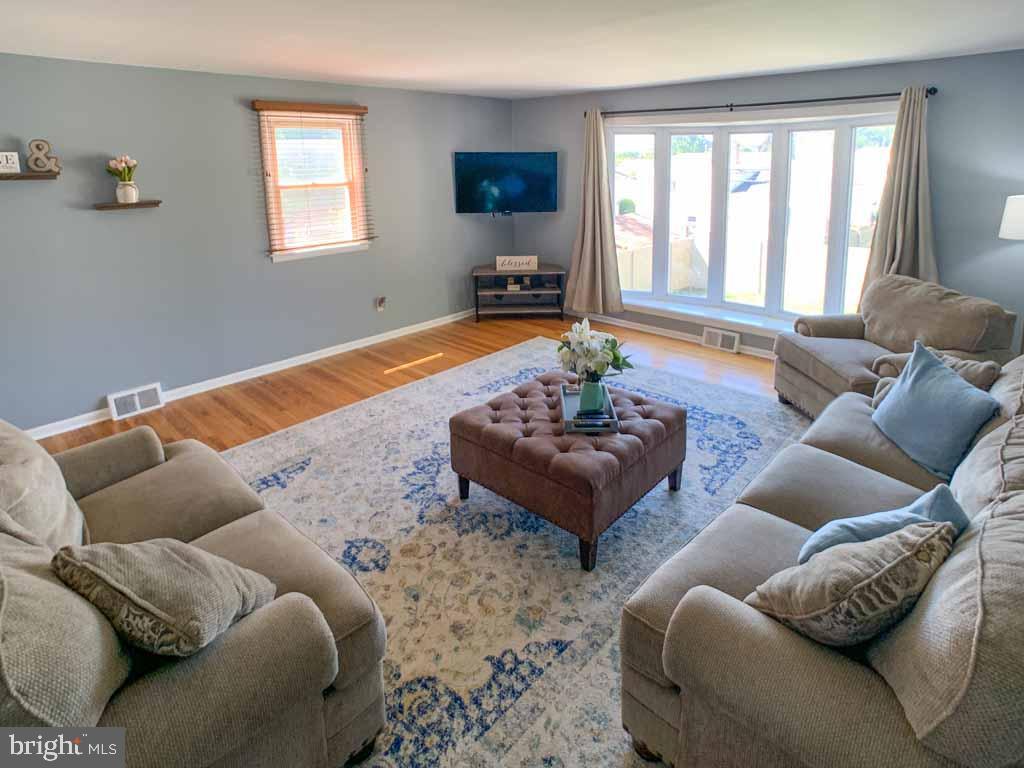 1148 Morefield Road Philadelphia, PA 19115 - Photo 5 of 35 a living room with furniture and a window