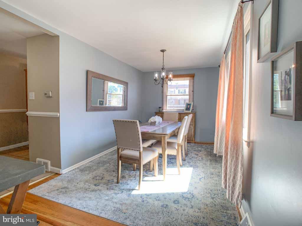 1148 Morefield Road Philadelphia, PA 19115 - Photo 7 of 35 a view of a dining room with furniture and chandelier