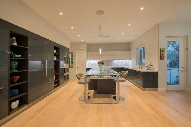 a view of a house with swimming pool and a yard