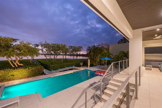 a spacious bedroom with a large bed and a large window