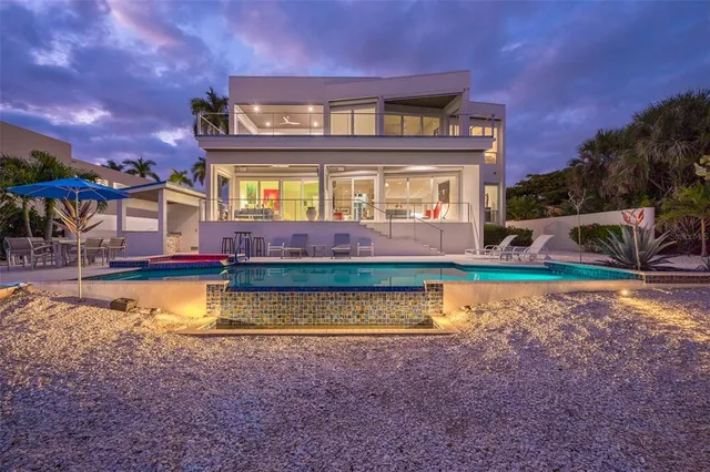 a bedroom with a bed lamp and window