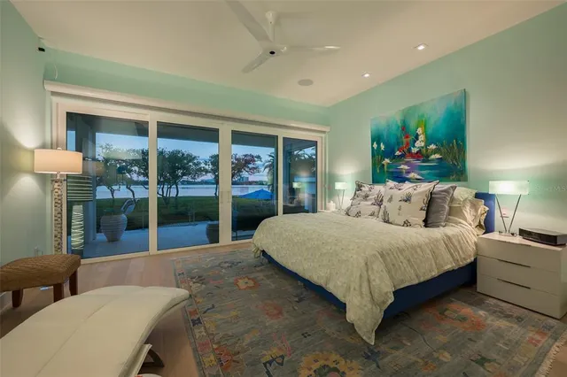 a bedroom with a bed and a lamp on table