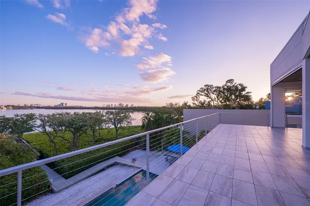 an aerial view of a house with a lake view
