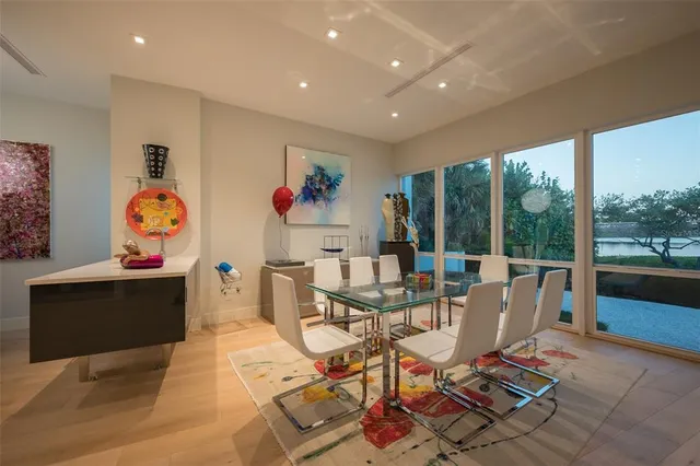 a kitchen with stainless steel appliances kitchen island granite countertop a large kitchen island a stove and a sink