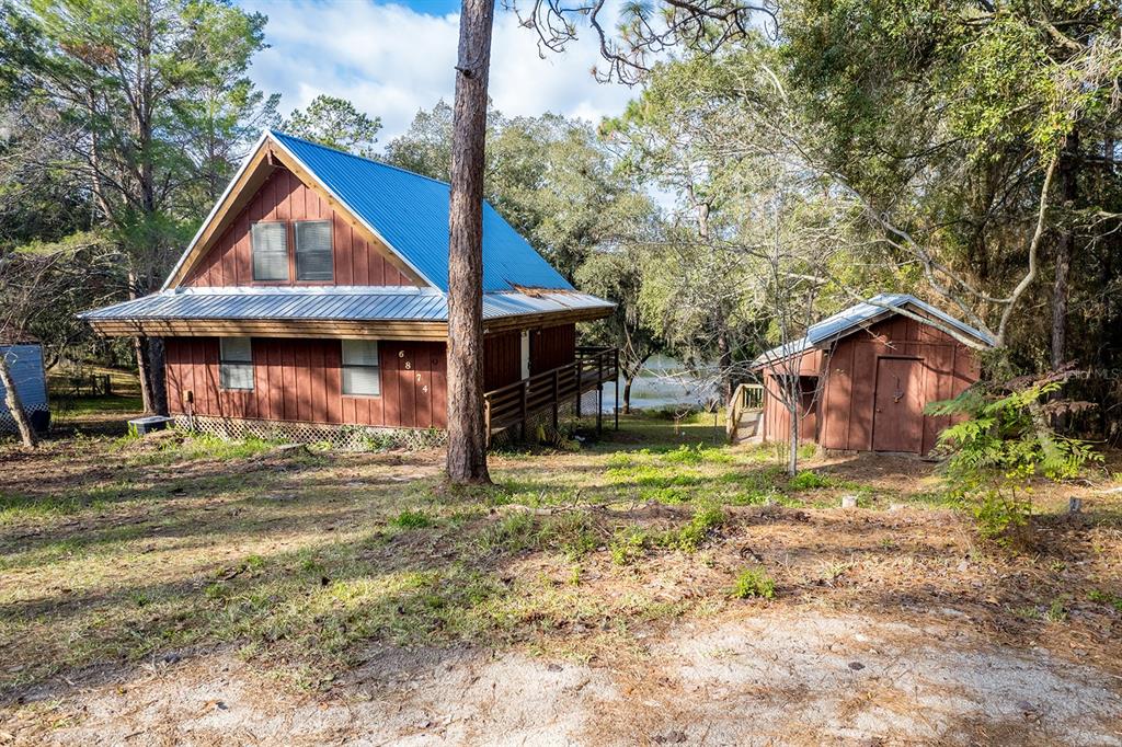 6874 Deer Springs Road Keystone Heights, FL 32656 - Photo 1 of 1 a view of a house with a yard