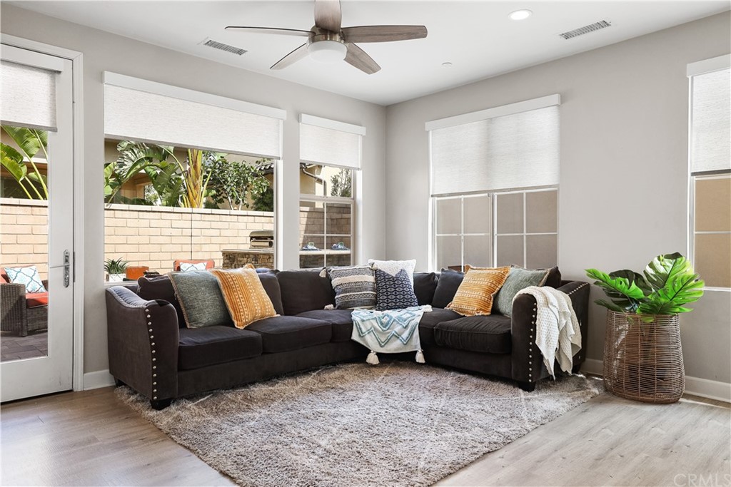 26 Lilac Lake Forest, CA 92630 - Photo 11 of 52 a living room with furniture potted plant and a large window