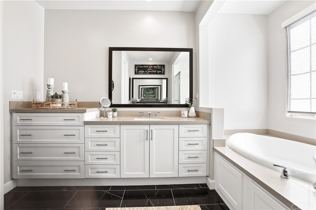 26 Lilac Lake Forest, CA 92630 - Photo 26 of 52 a bathroom with a sink a vanity and a mirror
