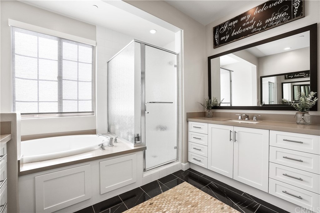 26 Lilac Lake Forest, CA 92630 - Photo 27 of 52 a spacious bathroom with a double vanity sink a mirror and a bathtub