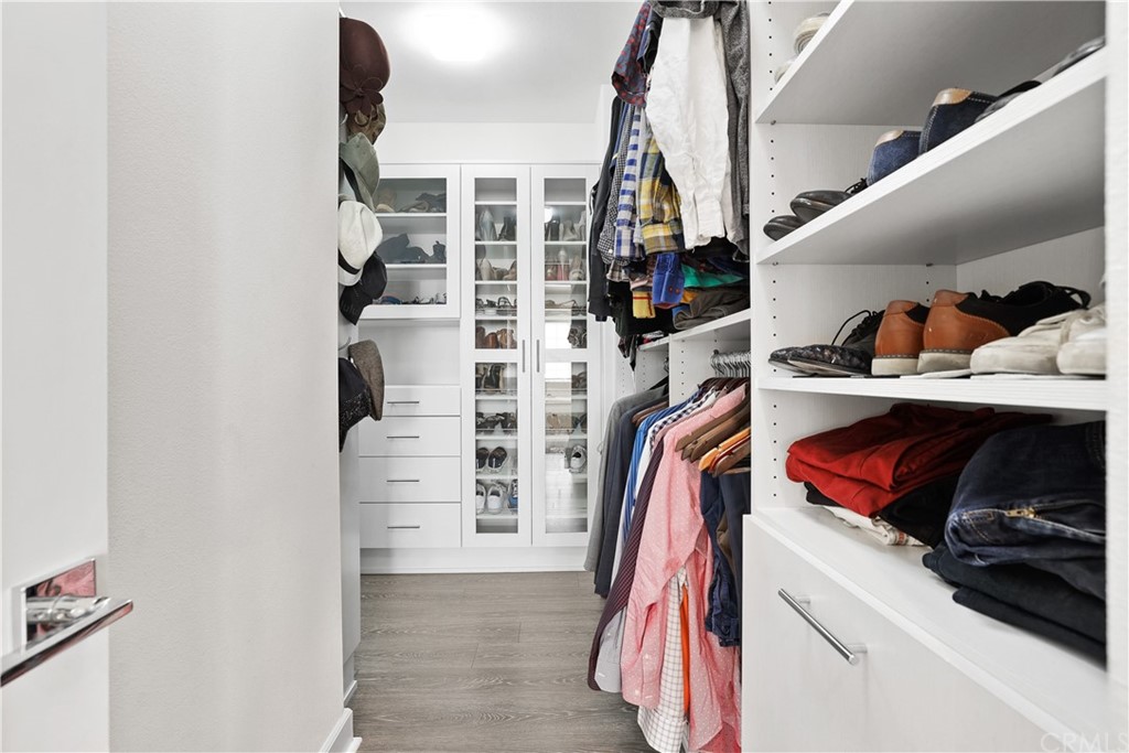 26 Lilac Lake Forest, CA 92630 - Photo 28 of 52 a view of walk in closet with clothes and shoes