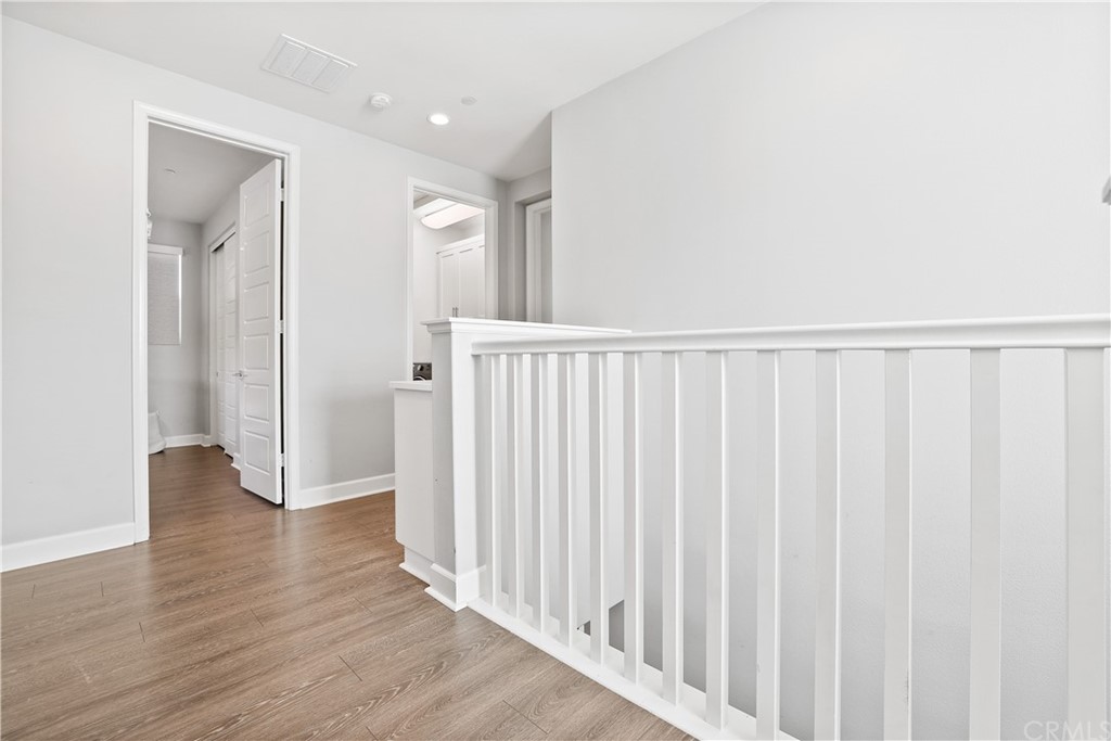 26 Lilac Lake Forest, CA 92630 - Photo 31 of 52 a view of a hallway with wooden floor