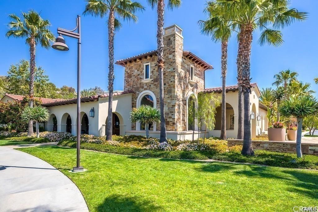 26 Lilac Lake Forest, CA 92630 - Photo 45 of 52 a front view of a house with a yard and palm trees