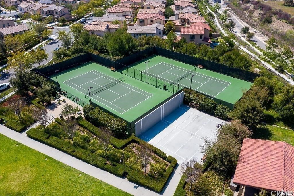26 Lilac Lake Forest, CA 92630 - Photo 48 of 52 an aerial view of a tennis ground and a cars park side of the road