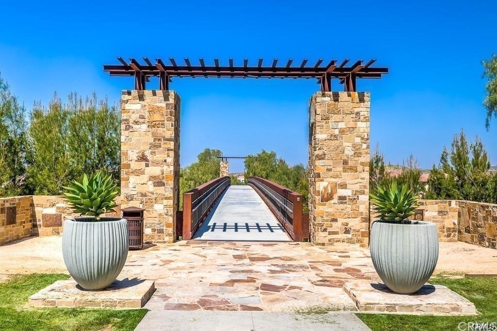 26 Lilac Lake Forest, CA 92630 - Photo 52 of 52 a view of a house with potted plants and a fountain