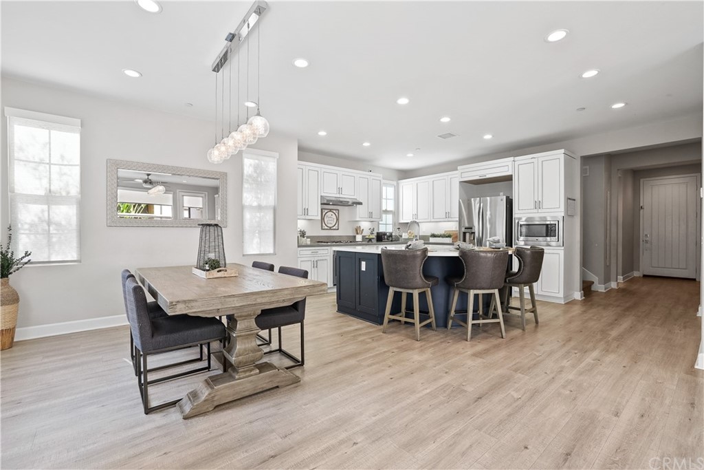 26 Lilac Lake Forest, CA 92630 - Photo 8 of 52 a view of a dining room with furniture and wooden floor