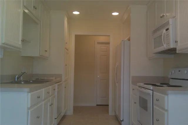 a view of empty room with a fireplace