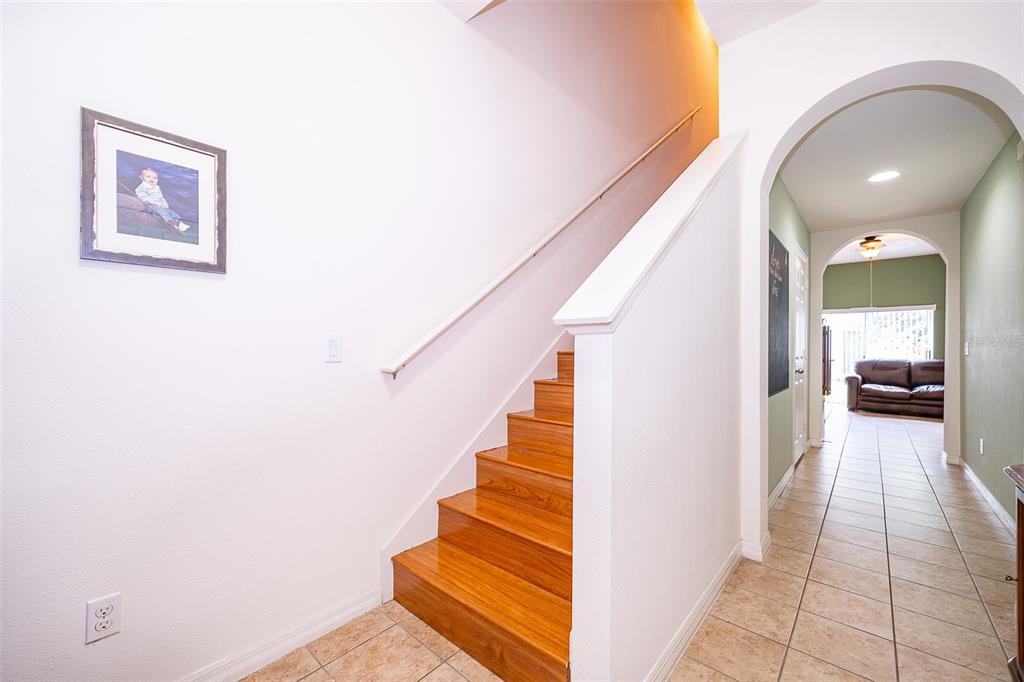 4113 Hedge Maple Place Winter Springs, FL 32708 - Photo 12 of 31 a view of entryway and hall with wooden floor