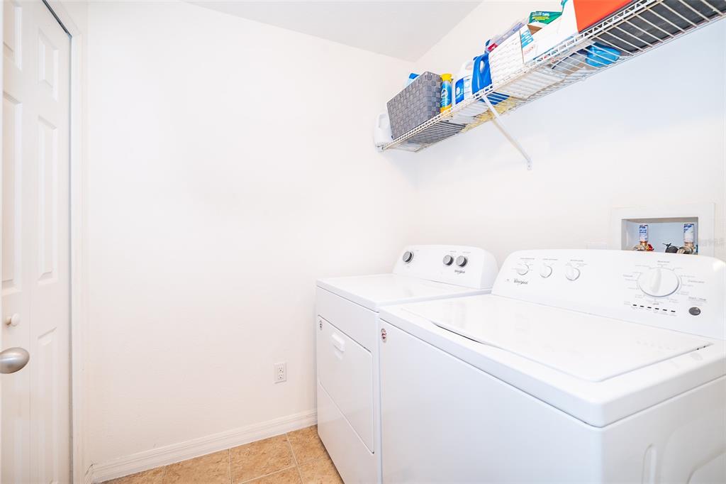 4113 Hedge Maple Place Winter Springs, FL 32708 - Photo 14 of 31 a utility room with dryer and washer