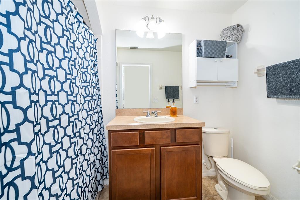 4113 Hedge Maple Place Winter Springs, FL 32708 - Photo 16 of 31 a bathroom with a sink toilet and mirror