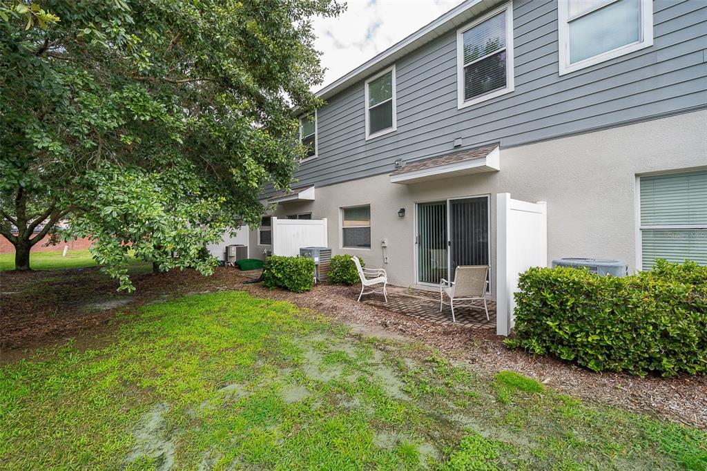 4113 Hedge Maple Place Winter Springs, FL 32708 - Photo 19 of 31 a view of an house with backyard space and garden