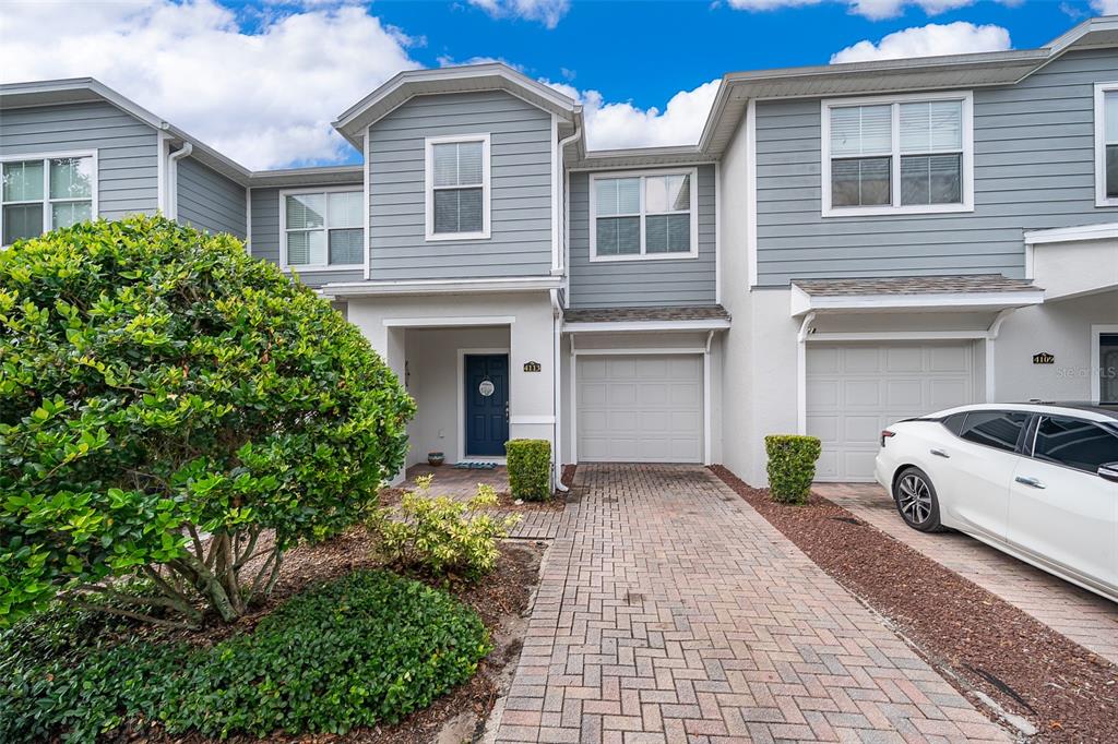 4113 Hedge Maple Place Winter Springs, FL 32708 - Photo 2 of 31 a front view of a house with a yard and garage