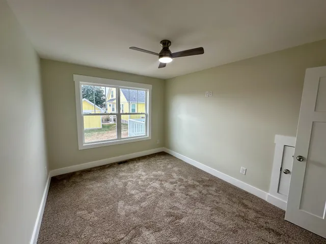 a view of house with backyard