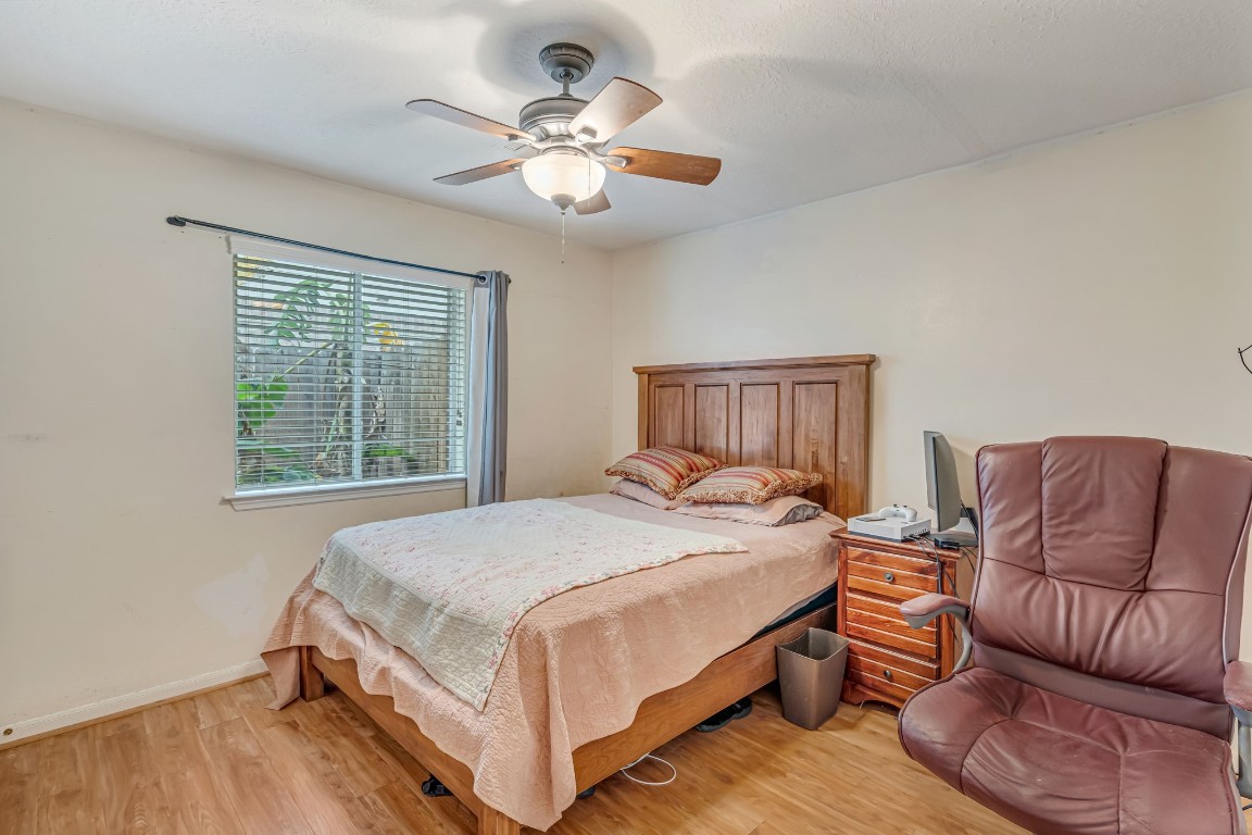 4614 Neches Trail Lane Spring, TX 77388 - Photo 24 of 29 a bedroom with a bed couch and window