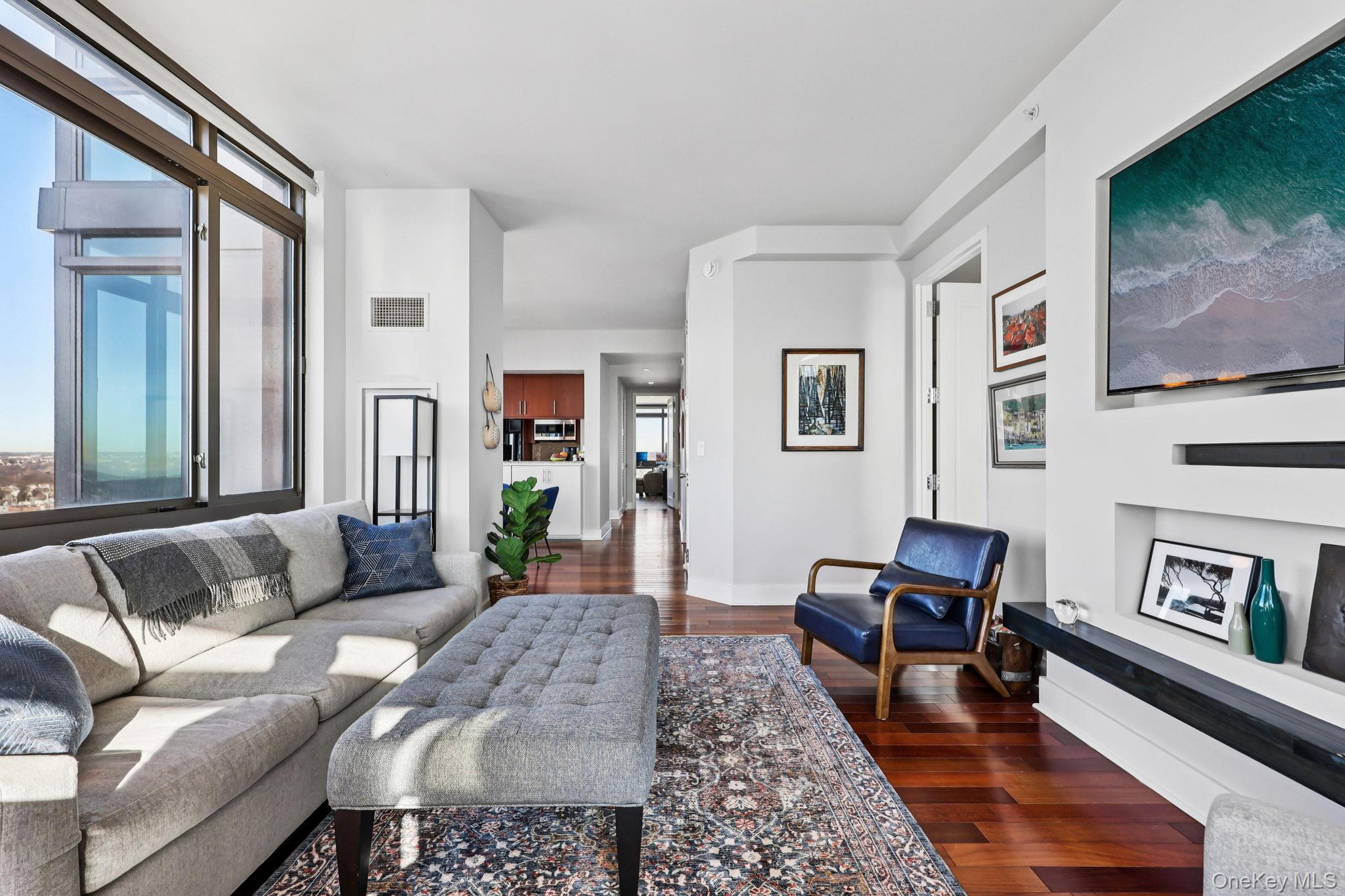 175 Huguenot Street, Unit 2503 New Rochelle, NY 10801 - Photo 1 of 32 a living room with furniture and a couch
