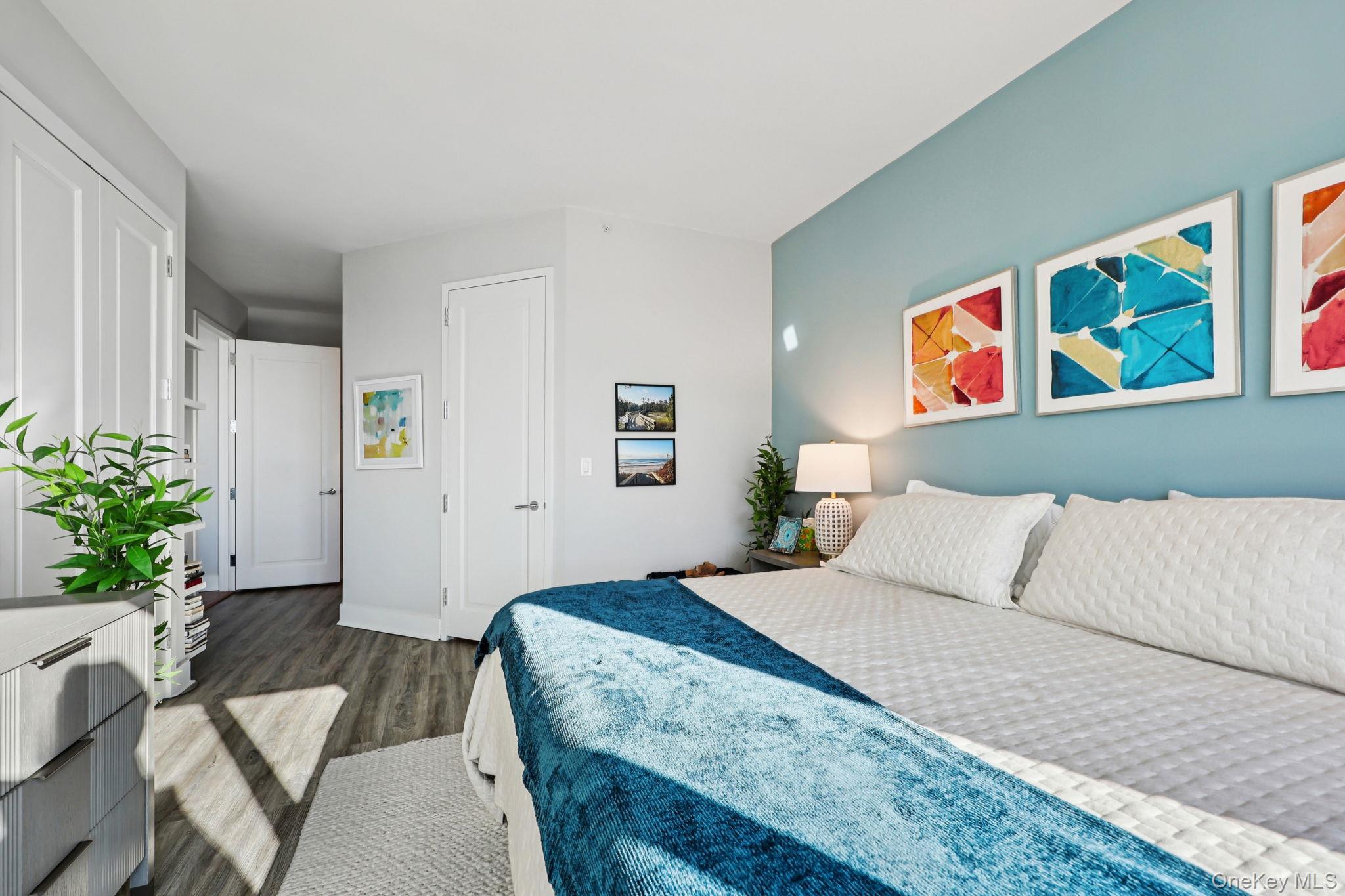 175 Huguenot Street, Unit 2503 New Rochelle, NY 10801 - Photo 17 of 32 a bedroom with a bed and a couch