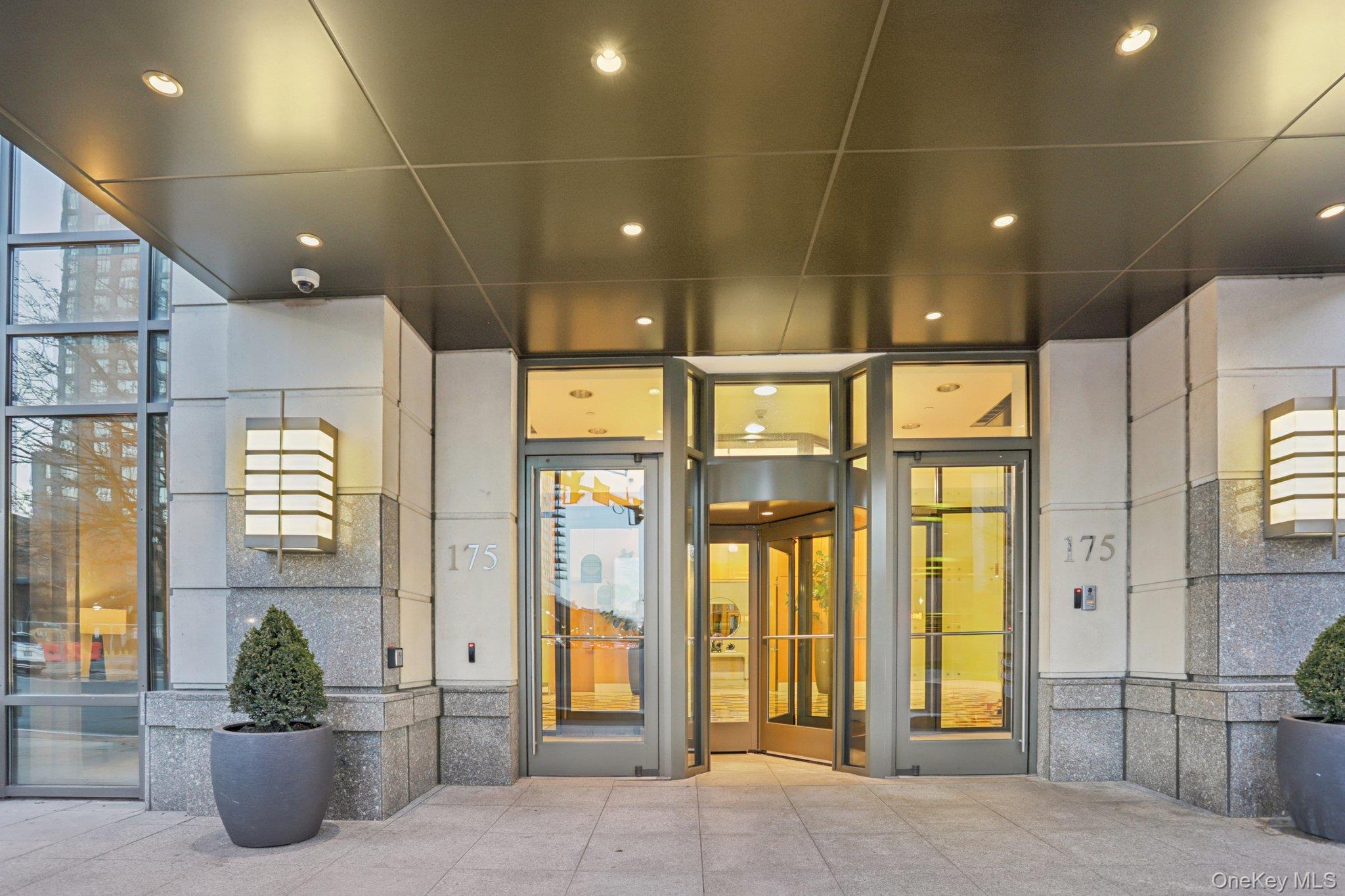 175 Huguenot Street, Unit 2503 New Rochelle, NY 10801 - Photo 24 of 32 a view of a building with glass door and glass door