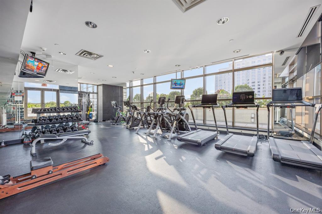 175 Huguenot Street, Unit 2503 New Rochelle, NY 10801 - Photo 32 of 32 a view of a room with gym equipment
