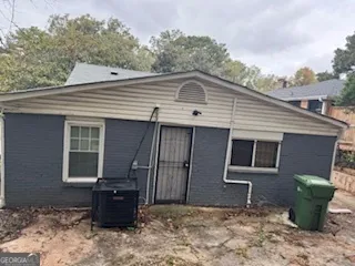 a backyard of a house with seating space