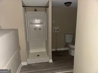 a bathroom with a glass shower door
